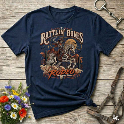 Blue t-shirt with short sleeves, with halloween design of rattlin'bones rodeo, with skull cowboy riding a horse in the desert
