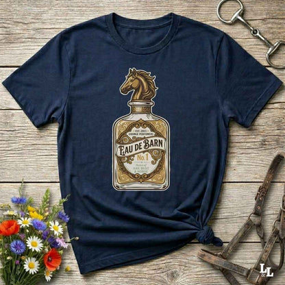 A navy blue short-sleeve t-shirt with a graphic print of a perfume bottle featuring a horse head and the text 'Feau de Barn No. 1'.