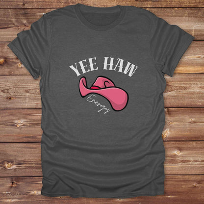 Fun western t-shirt for horse lovers and cowgirls. Western cowgirl graphic tee with horse design. Cowboy humor t-shirt for rodeo and country lovers. Horse lover funny t-shirt with western theme. Country style horse graphic tee for cowboys and cowgirls. Retro style funny western shirt for equestrians. Cute and funny country shirt with horse print. Southern cowgirl funny quote shirt for horse lovers. Yee Haw Energy with Pink Cowgirl Hat.