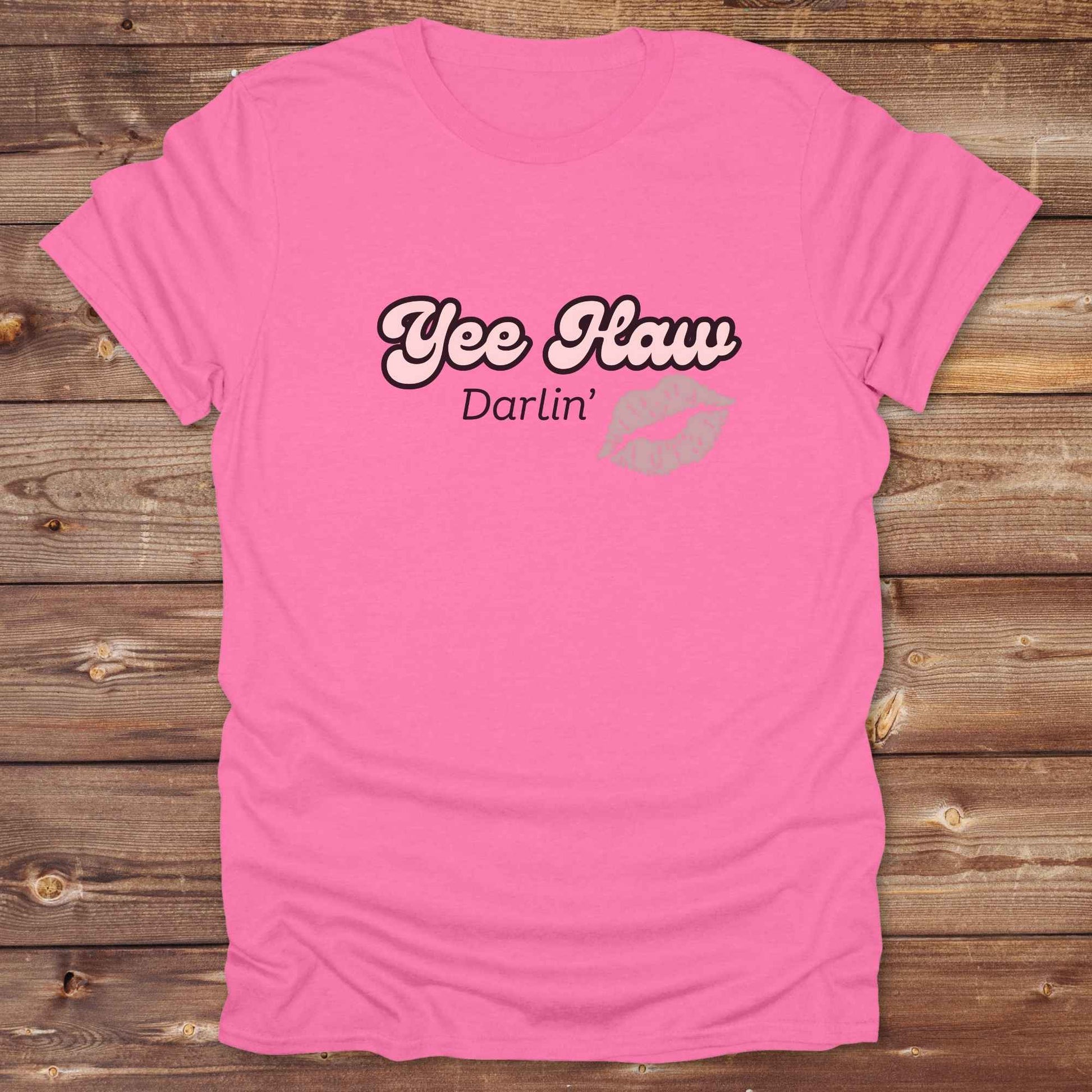 Fun western t-shirt for horse lovers and cowgirls. Western cowgirl graphic tee with horse design. Cowboy humor t-shirt for rodeo and country lovers. Horse lover funny t-shirt with western theme. Country style horse graphic tee for cowboys and cowgirls. Retro style funny western shirt for equestrians. Cute and funny country shirt with horse print. Southern cowgirl funny quote shirt for horse lovers. Yee Haw Darlin' Kiss.