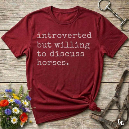 red Funny horse lover t-shirt that reads ‘Introverted but willing to discuss horses’ in western typography