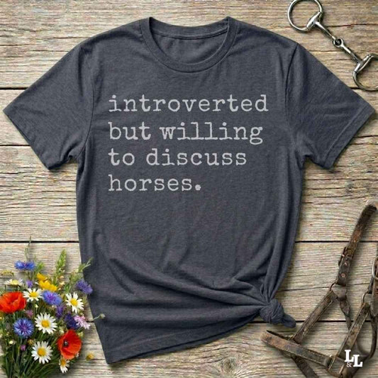 gray Funny horse lover t-shirt that reads ‘Introverted but willing to discuss horses’ in western typography
