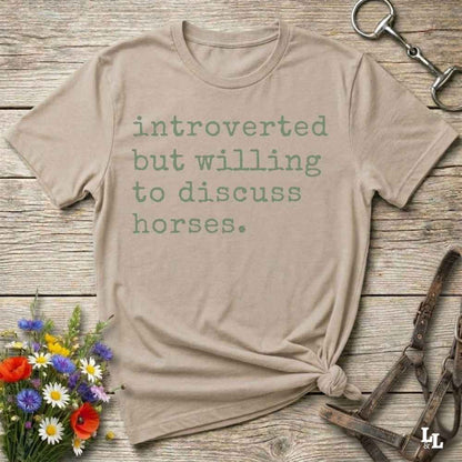 beige Funny horse lover t-shirt that reads ‘Introverted but willing to discuss horses’ in western typography