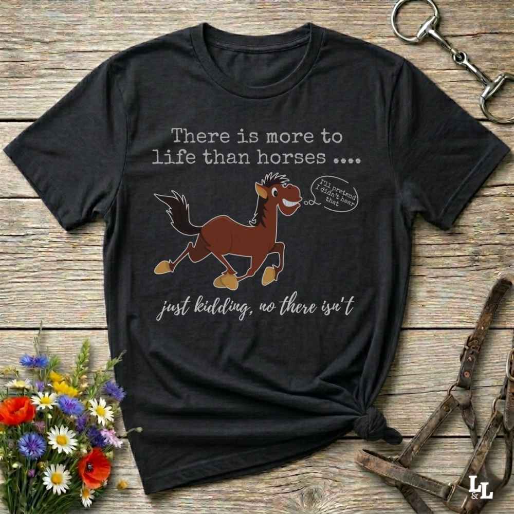 A black graphic t-shirt featuring a cartoon brown horse with the text 'There is more to life than horses .