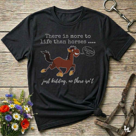A black graphic t-shirt featuring a cartoon brown horse with the text 'There is more to life than horses .