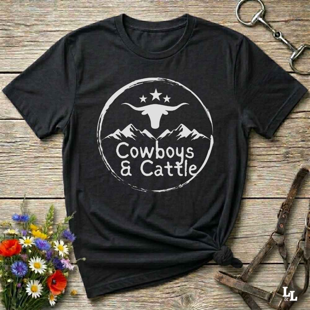 Fun western t-shirt featuring horse themed design for cowgirls, cowboys, horse lovers and equestrians, perfect for rodeo lovers, rustic style fans, and horse people. Unique graphic tee by Lasso and Loom.  Cowboys and cattle with mountain range and longhorn skull.