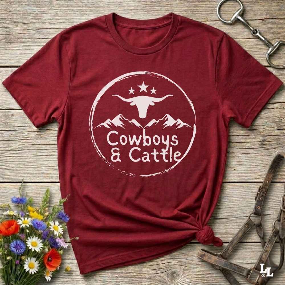 Fun western t-shirt featuring horse themed design for cowgirls, cowboys, horse lovers and equestrians, perfect for rodeo lovers, rustic style fans, and horse people. Unique graphic tee by Lasso and Loom.  Cowboys and cattle with mountain range and longhorn skull.