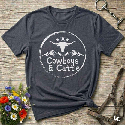Fun western t-shirt featuring horse themed design for cowgirls, cowboys, horse lovers and equestrians, perfect for rodeo lovers, rustic style fans, and horse people. Unique graphic tee by Lasso and Loom.  Cowboys and cattle with mountain range and longhorn skull.