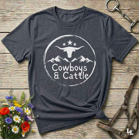 Fun western t-shirt featuring horse themed design for cowgirls, cowboys, horse lovers and equestrians, perfect for rodeo lovers, rustic style fans, and horse people. Unique graphic tee by Lasso and Loom.  Cowboys and cattle with mountain range and longhorn skull.