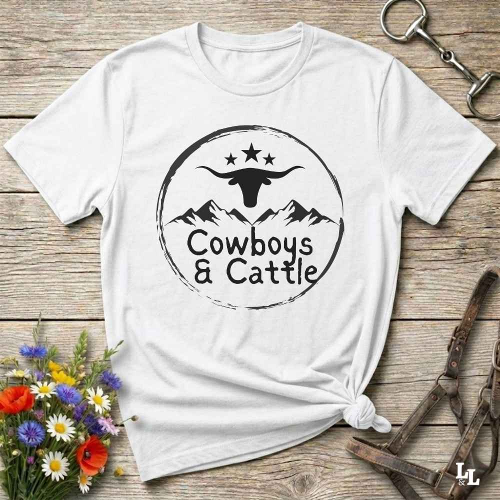 Fun western t-shirt featuring horse themed design for cowgirls, cowboys, horse lovers and equestrians, perfect for rodeo lovers, rustic style fans, and horse people. Unique graphic tee by Lasso and Loom.  Cowboys and cattle with mountain range and longhorn skull.