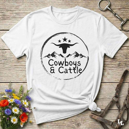 Fun western t-shirt featuring horse themed design for cowgirls, cowboys, horse lovers and equestrians, perfect for rodeo lovers, rustic style fans, and horse people. Unique graphic tee by Lasso and Loom.  Cowboys and cattle with mountain range and longhorn skull.