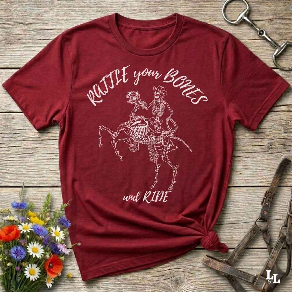 Fun western t-shirt featuring horse themed design for cowgirls, cowboys, horse lovers and equestrians, perfect for rodeo lovers, rustic style fans, and horse people. Unique graphic tee by Lasso and Loom.  Rattle your bones and ride.