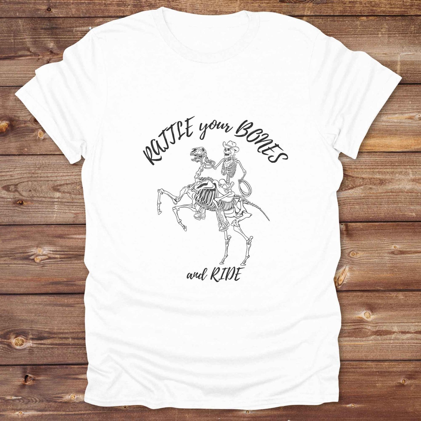 Fun western t-shirt featuring horse themed design for cowgirls, cowboys, horse lovers and equestrians, perfect for rodeo lovers, rustic style fans, and horse people. Unique graphic tee by Lasso and Loom.  Rattle your bones and ride.