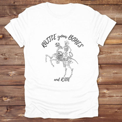 Fun western t-shirt featuring horse themed design for cowgirls, cowboys, horse lovers and equestrians, perfect for rodeo lovers, rustic style fans, and horse people. Unique graphic tee by Lasso and Loom.  Rattle your bones and ride.