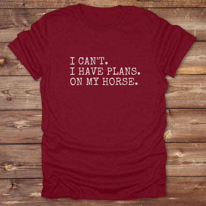 Fun western t-shirt featuring horse themed design for cowgirls, cowboys, horse lovers and equestrians, perfect for rodeo lovers, rustic style fans, and horse people. Unique graphic tee by Lasso and Loom.  I Can't I have plans.