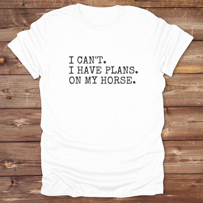Fun western t-shirt featuring horse themed design for cowgirls, cowboys, horse lovers and equestrians, perfect for rodeo lovers, rustic style fans, and horse people. Unique graphic tee by Lasso and Loom.  I Can't I have plans.