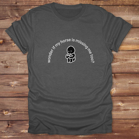Fun western t-shirt featuring horse themed design for cowgirls, cowboys, horse lovers and equestrians, perfect for rodeo lovers, rustic style fans, and horse people. Unique graphic tee by Lasso and Loom.  Wonder if my horse is missing me too.