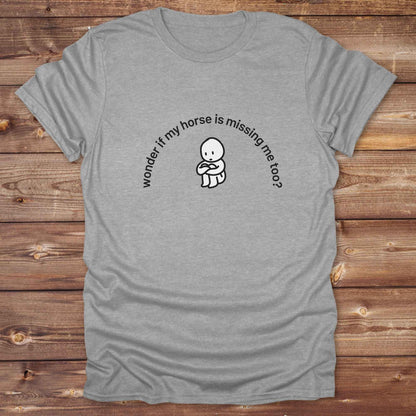 Fun western t-shirt featuring horse themed design for cowgirls, cowboys, horse lovers and equestrians, perfect for rodeo lovers, rustic style fans, and horse people. Unique graphic tee by Lasso and Loom.  Wonder if my horse is missing me too.