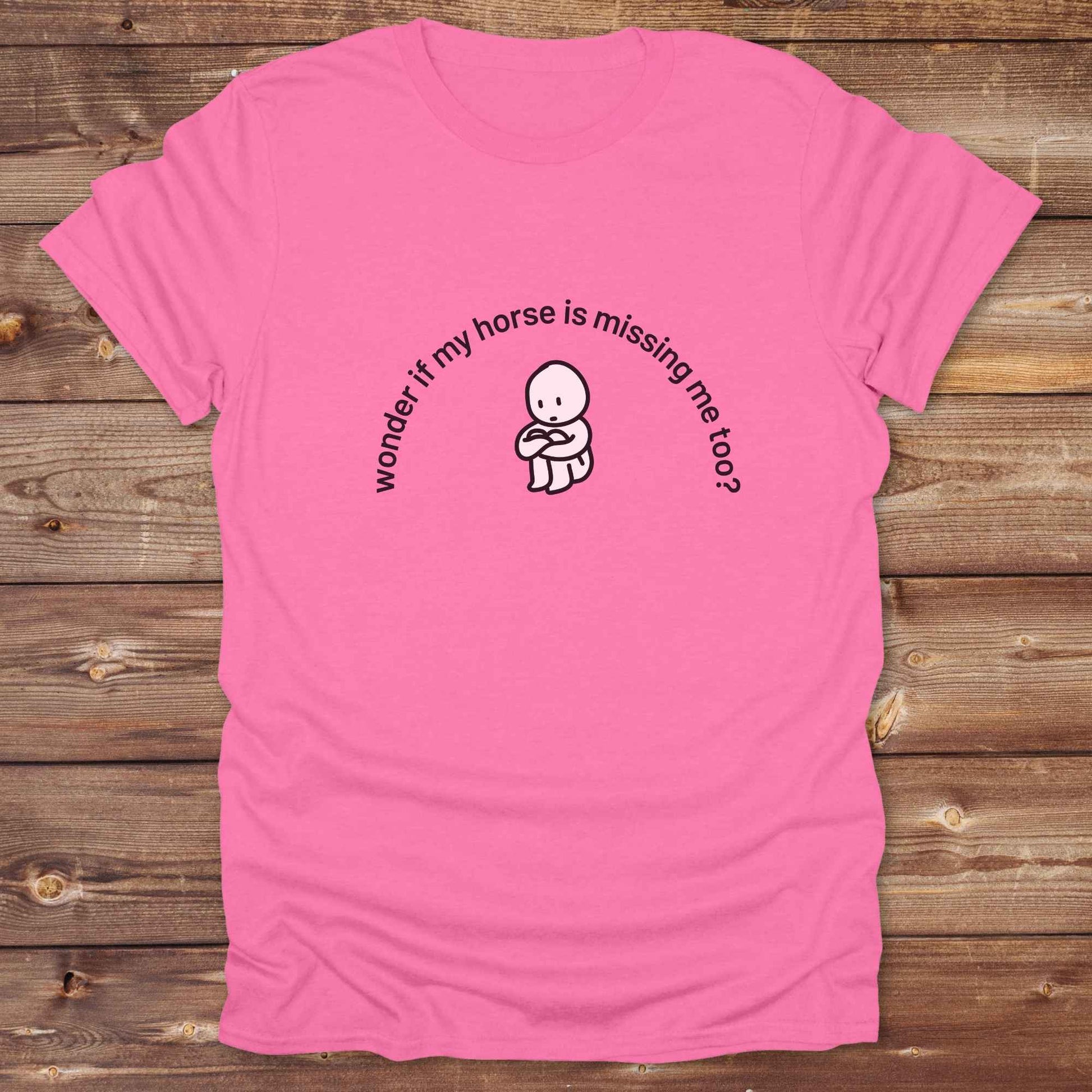 Fun western t-shirt featuring horse themed design for cowgirls, cowboys, horse lovers and equestrians, perfect for rodeo lovers, rustic style fans, and horse people. Unique graphic tee by Lasso and Loom.  Wonder if my horse is missing me too.