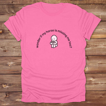 Fun western t-shirt featuring horse themed design for cowgirls, cowboys, horse lovers and equestrians, perfect for rodeo lovers, rustic style fans, and horse people. Unique graphic tee by Lasso and Loom.  Wonder if my horse is missing me too.