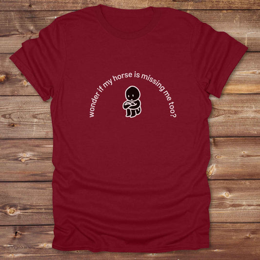 Fun western t-shirt featuring horse themed design for cowgirls, cowboys, horse lovers and equestrians, perfect for rodeo lovers, rustic style fans, and horse people. Unique graphic tee by Lasso and Loom.  Wonder if my horse is missing me too.