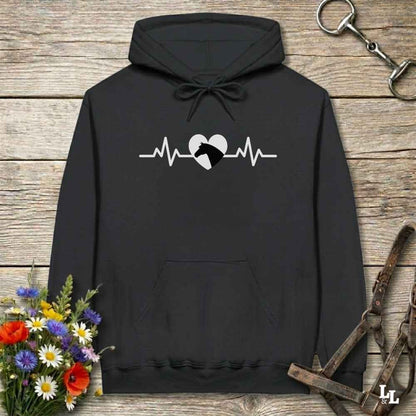 Black hoodie with text Heartbeat line and a horse head, on wooden background with equestrian bit and halter and flowers