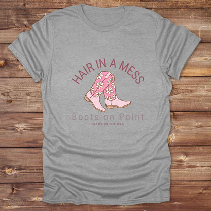 Fun western t-shirt featuring horse themed design for cowgirls, cowboys, horse lovers and equestrians, perfect for rodeo lovers, rustic style fans, and horse people. Unique graphic tee by Lasso and Loom. Hair in a Mess Boots on Point.