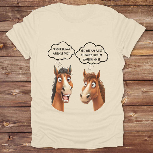 Fun western t-shirt for horse lovers and cowgirls. Western cowgirl graphic tee with horse design. Cowboy humor t-shirt for rodeo and country lovers. Horse lover funny t-shirt with western theme. Country style horse graphic tee for cowboys and cowgirls. Retro style funny western shirt for equestrians. Cute and funny country shirt with horse print. Southern cowgirl funny quote shirt for horse lovers. Is your human a rescue? Yes, she has a lot of issues, but I'm working on it.