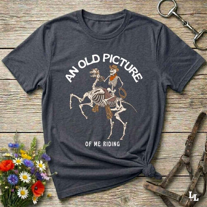 Saddle up with spooky western vibes in this skeleton cowboy “Old Picture of Me Riding” shirt, perfect for rodeo lovers and Halloween humor fans. This cowboy skeleton t-shirt combines retro western style with dark humor, ideal for ranchers, riders, and funny costume alternatives. Make fall fashion unforgettable with this witty, rustic western parody tee featuring bones, boots, and bold cowboy nostalgia.