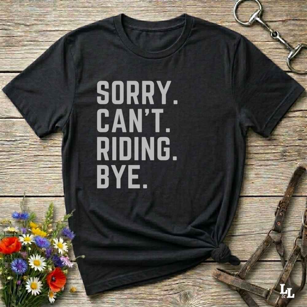 This “Sorry Can’t. Riding. Bye.” western typography tee is the perfect gift for horse lovers, trail riders, and anyone living the cowboy or cowgirl lifestyle. Made from premium Gildan 64000 cotton, it's unisex and available in 8 colors to match your cowboy core aesthetic. Whether you're off to a rodeo, riding horses, or just showing off your rustic humor, this bold minimalist horse quote shirt delivers personality and comfort. Great for birthdays, western lovers, and equestrian fashion fans.