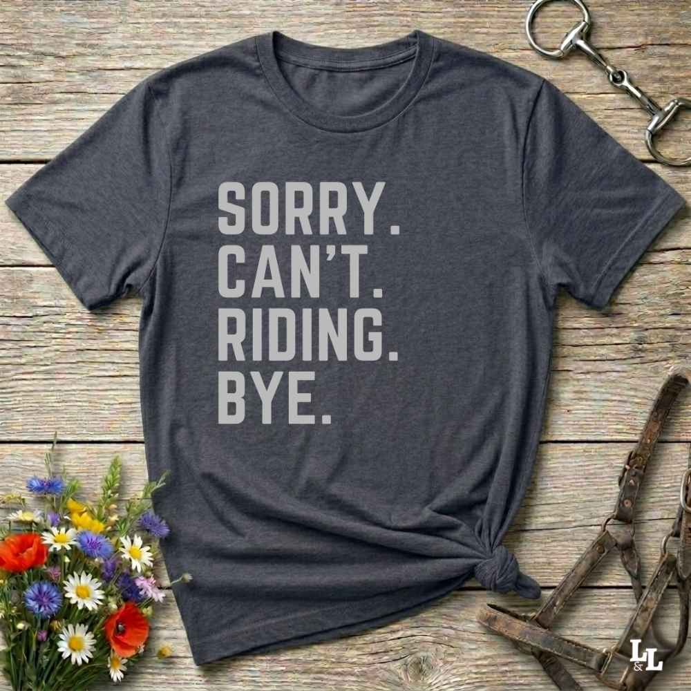 This “Sorry Can’t. Riding. Bye.” western typography tee is the perfect gift for horse lovers, trail riders, and anyone living the cowboy or cowgirl lifestyle. Made from premium Gildan 64000 cotton, it's unisex and available in 8 colors to match your cowboy core aesthetic. Whether you're off to a rodeo, riding horses, or just showing off your rustic humor, this bold minimalist horse quote shirt delivers personality and comfort. Great for birthdays, western lovers, and equestrian fashion fans.