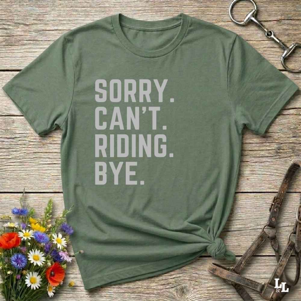 This “Sorry Can’t. Riding. Bye.” western typography tee is the perfect gift for horse lovers, trail riders, and anyone living the cowboy or cowgirl lifestyle. Made from premium Gildan 64000 cotton, it's unisex and available in 8 colors to match your cowboy core aesthetic. Whether you're off to a rodeo, riding horses, or just showing off your rustic humor, this bold minimalist horse quote shirt delivers personality and comfort. Great for birthdays, western lovers, and equestrian fashion fans.