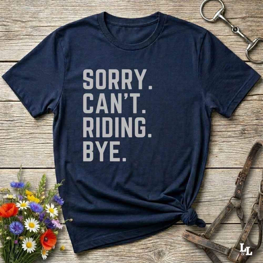 This “Sorry Can’t. Riding. Bye.” western typography tee is the perfect gift for horse lovers, trail riders, and anyone living the cowboy or cowgirl lifestyle. Made from premium Gildan 64000 cotton, it's unisex and available in 8 colors to match your cowboy core aesthetic. Whether you're off to a rodeo, riding horses, or just showing off your rustic humor, this bold minimalist horse quote shirt delivers personality and comfort. Great for birthdays, western lovers, and equestrian fashion fans.