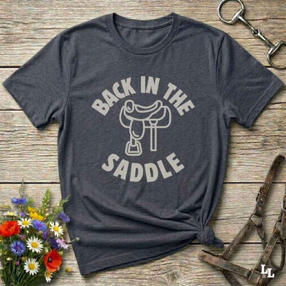 Our "Back in the Saddle" t-shirt is the perfect western-style graphic tee for cowboys and cowgirls who love horseback riding, rodeo culture, and rustic country fashion. Featuring a clean saddle illustration and retro western typography, this shirt blends comfort and character, making it ideal for ranch wear, horse lovers, and rodeo enthusiasts. Whether you're heading to a country concert, festival, or barn, this tee stands out. Makes a great gift for horse riders, western fans or anyone getting back riding