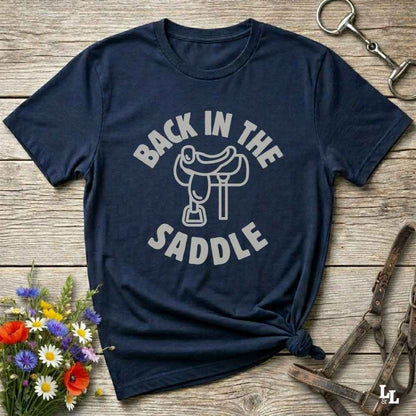 Our "Back in the Saddle" t-shirt is the perfect western-style graphic tee for cowboys and cowgirls who love horseback riding, rodeo culture, and rustic country fashion. Featuring a clean saddle illustration and retro western typography, this shirt blends comfort and character, making it ideal for ranch wear, horse lovers, and rodeo enthusiasts. Whether you're heading to a country concert, festival, or barn, this tee stands out. Makes a great gift for horse riders, western fans or anyone getting back riding