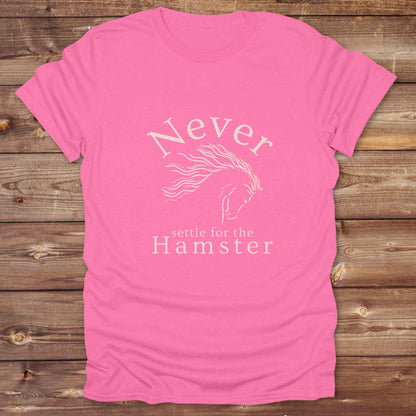 "Never Settle for the Hamster" T-shirt a funny and empowering western tee designed for horse lovers, cowgirls, and cowboy humor fans. Bold typography and flowing horse graphic, perfect for rodeo events, country fairs, or everyday ranch life. Whether you're buying for yourself or gifting to a wild-hearted horse girl, this shirt makes a statement that’s as fierce as your spirit.