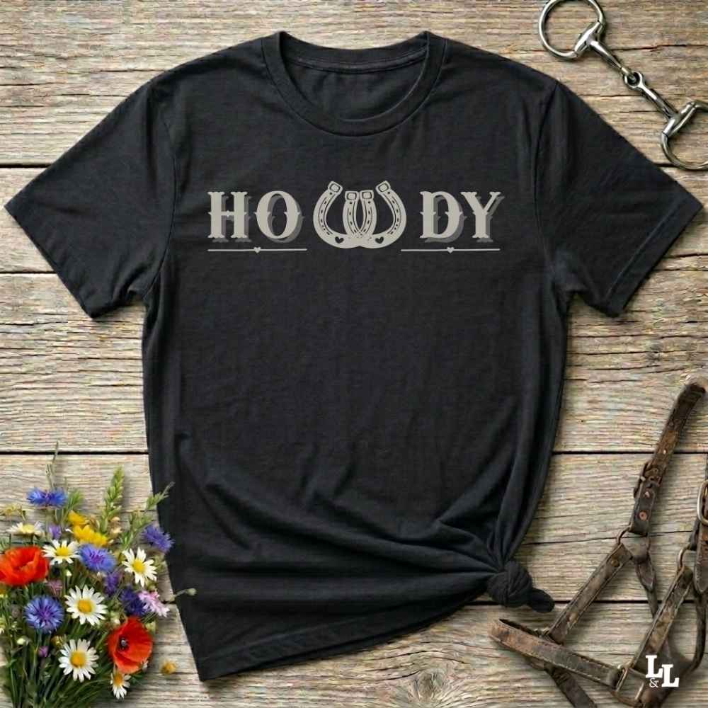 Say “Howdy” in true western style with this rustic horseshoe tee designed for cowboys, cowgirls, and horse lovers alike. Featuring a bold western font and a double horseshoe “W,” this shirt blends southern charm with modern rodeo flair. It's perfect for birthdays, rodeo weekends, country fairs, or just everyday ranch life. Whether you're a rancher, rider, or rural rebel, this shirt adds a little yeehaw to your wardrobe.