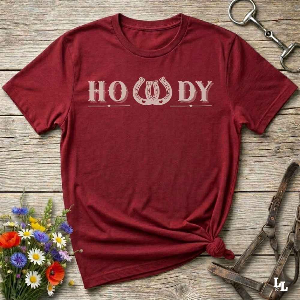 Say “Howdy” in true western style with this rustic horseshoe tee designed for cowboys, cowgirls, and horse lovers alike. Featuring a bold western font and a double horseshoe “W,” this shirt blends southern charm with modern rodeo flair. It's perfect for birthdays, rodeo weekends, country fairs, or just everyday ranch life. Whether you're a rancher, rider, or rural rebel, this shirt adds a little yeehaw to your wardrobe.