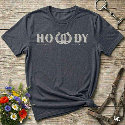 Say “Howdy” in true western style with this rustic horseshoe tee designed for cowboys, cowgirls, and horse lovers alike. Featuring a bold western font and a double horseshoe “W,” this shirt blends southern charm with modern rodeo flair. It's perfect for birthdays, rodeo weekends, country fairs, or just everyday ranch life. Whether you're a rancher, rider, or rural rebel, this shirt adds a little yeehaw to your wardrobe.
