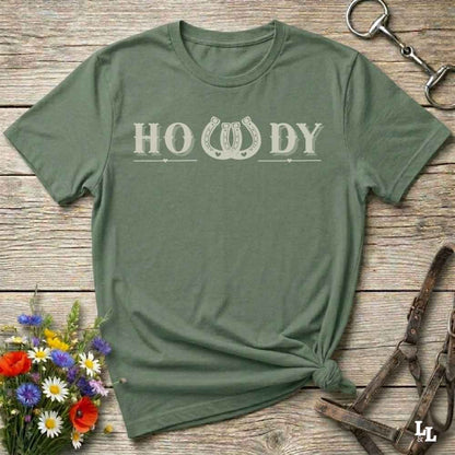 Say “Howdy” in true western style with this rustic horseshoe tee designed for cowboys, cowgirls, and horse lovers alike. Featuring a bold western font and a double horseshoe “W,” this shirt blends southern charm with modern rodeo flair. It's perfect for birthdays, rodeo weekends, country fairs, or just everyday ranch life. Whether you're a rancher, rider, or rural rebel, this shirt adds a little yeehaw to your wardrobe.