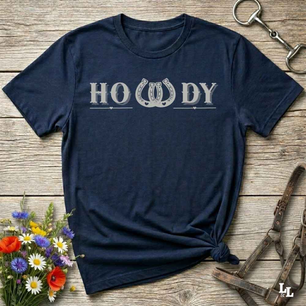 Say “Howdy” in true western style with this rustic horseshoe tee designed for cowboys, cowgirls, and horse lovers alike. Featuring a bold western font and a double horseshoe “W,” this shirt blends southern charm with modern rodeo flair. It's perfect for birthdays, rodeo weekends, country fairs, or just everyday ranch life. Whether you're a rancher, rider, or rural rebel, this shirt adds a little yeehaw to your wardrobe.