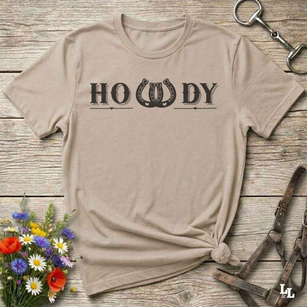 Say “Howdy” in true western style with this rustic horseshoe tee designed for cowboys, cowgirls, and horse lovers alike. Featuring a bold western font and a double horseshoe “W,” this shirt blends southern charm with modern rodeo flair. It's perfect for birthdays, rodeo weekends, country fairs, or just everyday ranch life. Whether you're a rancher, rider, or rural rebel, this shirt adds a little yeehaw to your wardrobe.