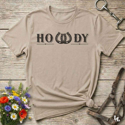 Say “Howdy” in true western style with this rustic horseshoe tee designed for cowboys, cowgirls, and horse lovers alike. Featuring a bold western font and a double horseshoe “W,” this shirt blends southern charm with modern rodeo flair. It's perfect for birthdays, rodeo weekends, country fairs, or just everyday ranch life. Whether you're a rancher, rider, or rural rebel, this shirt adds a little yeehaw to your wardrobe.