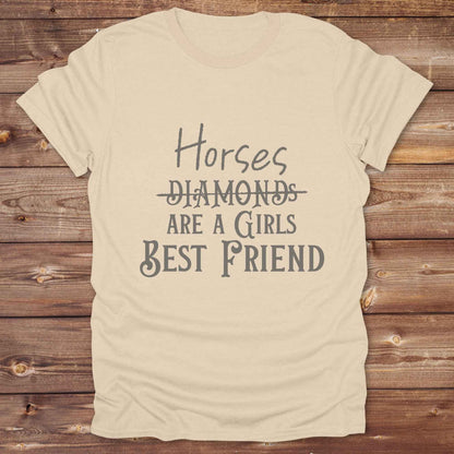 “Horses Are a Girl’s Best Friend” tee from Lasso and Loom is the perfect blend of sass and saddle ready style. Featuring a rustic hand lettered graphic with the word Diamonds cheekily crossed out, this cowgirl shirt celebrates equestrian passion in the most fashionable way. Ideal as a gift for horse lovers, western girls, and rural soul sisters. Whether you're trail riding, shopping small, or posting from the paddock, this shirt says what every horse girl already knows, diamonds don’t ride.