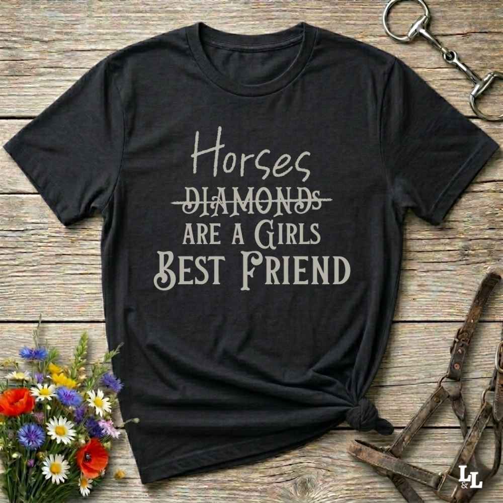 Horses Are a Girl’s Best Friend” black tee from Lasso and Loom is the perfect blend of sass and saddle ready style. Featuring a rustic hand lettered graphic with the word Diamonds cheekily crossed out, this cowgirl shirt celebrates equestrian passion in the most fashionable way. Ideal as a gift for horse lovers, western girls, and rural soul sisters. Whether you're trail riding, shopping small, or posting from the paddock, this shirt says what every horse girl already knows, diamonds don’t ride.