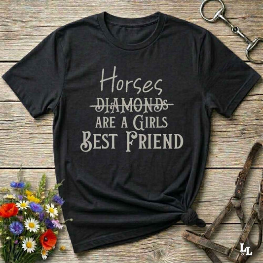 Horses Are a Girl’s Best Friend” black tee from Lasso and Loom is the perfect blend of sass and saddle ready style. Featuring a rustic hand lettered graphic with the word Diamonds cheekily crossed out, this cowgirl shirt celebrates equestrian passion in the most fashionable way. Ideal as a gift for horse lovers, western girls, and rural soul sisters. Whether you're trail riding, shopping small, or posting from the paddock, this shirt says what every horse girl already knows, diamonds don’t ride.