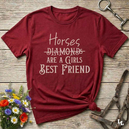Horses Are a Girl’s Best Friend” red tee from Lasso and Loom is the perfect blend of sass and saddle ready style. Featuring a rustic hand lettered graphic with the word Diamonds cheekily crossed out, this cowgirl shirt celebrates equestrian passion in the most fashionable way. Ideal as a gift for horse lovers, western girls, and rural soul sisters. Whether you're trail riding, shopping small, or posting from the paddock, this shirt says what every horse girl already knows, diamonds don’t ride.