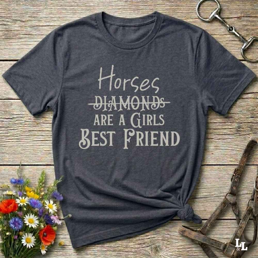 Horses Are a Girl’s Best Friend” gray tee from Lasso and Loom is the perfect blend of sass and saddle ready style. Featuring a rustic hand lettered graphic with the word Diamonds cheekily crossed out, this cowgirl shirt celebrates equestrian passion in the most fashionable way. Ideal as a gift for horse lovers, western girls, and rural soul sisters. Whether you're trail riding, shopping small, or posting from the paddock, this shirt says what every horse girl already knows, diamonds don’t ride.