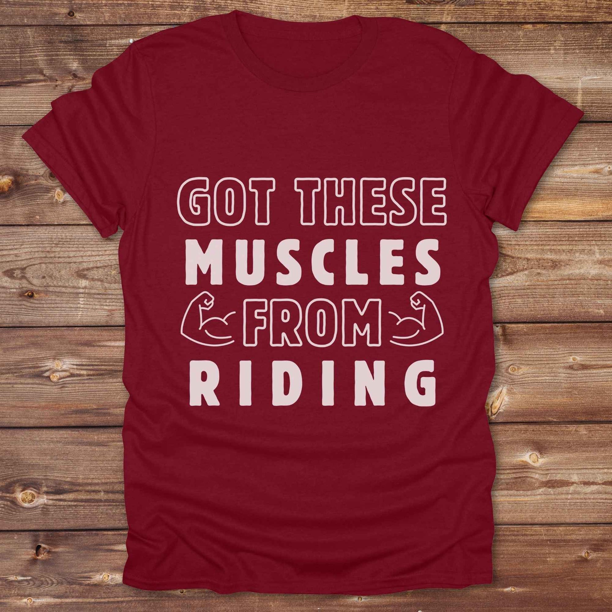“Got These Muscles from Riding” western t-shirt is perfect for cowgirls, cowboys, horse lovers, and rodeo fans who live strong without stepping in a gym. Designed for equestrians and rural riders who know their strength comes from the saddle, this funny and bold graphic tee is a conversation starter at any barn, rodeo, or Western event. Makes a great gift for horseback riders, trainers, or country girls who work hard and flex harder.