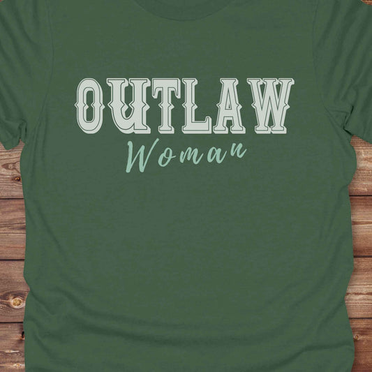 Unleash your inner cowgirl with our Outlaw Woman T-Shirt — a bold, western-inspired tee made for fierce, free-spirited women. Featuring vintage typography and rustic charm, it’s the perfect fit for country girls, rodeo lovers, and horse-riding rebels alike. Ideal as a unique gift or statement piece, this shirt pairs classic outlaw vibes with soft, wearable comfort. Whether you're hitting the trails, rocking the fairgrounds, or lounging in cowgirl style, this tee says you’re wild and proud.